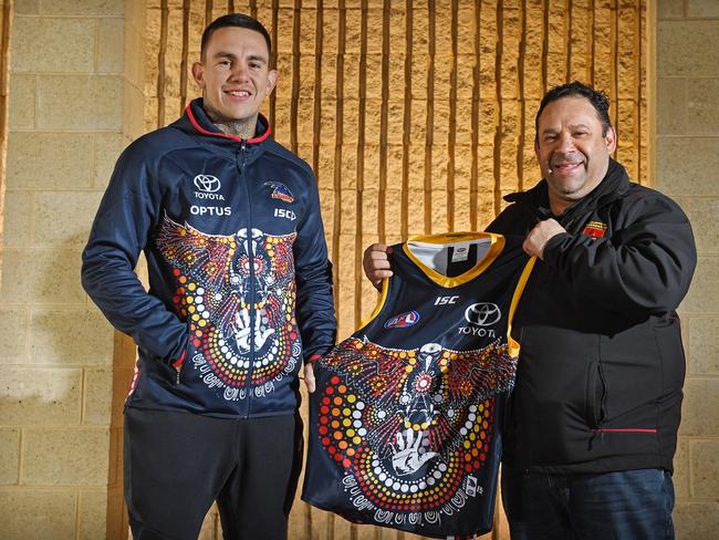 Artist Shane Cook and former crows player Eddie Hocking who came up with the design for the Crows indigenous jumper. Picture: Tom Huntley