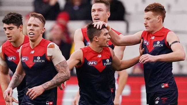 Melbourne players celebrate a goal during their win over Fremantle. Picture: Michael Dodge/Getty Images.