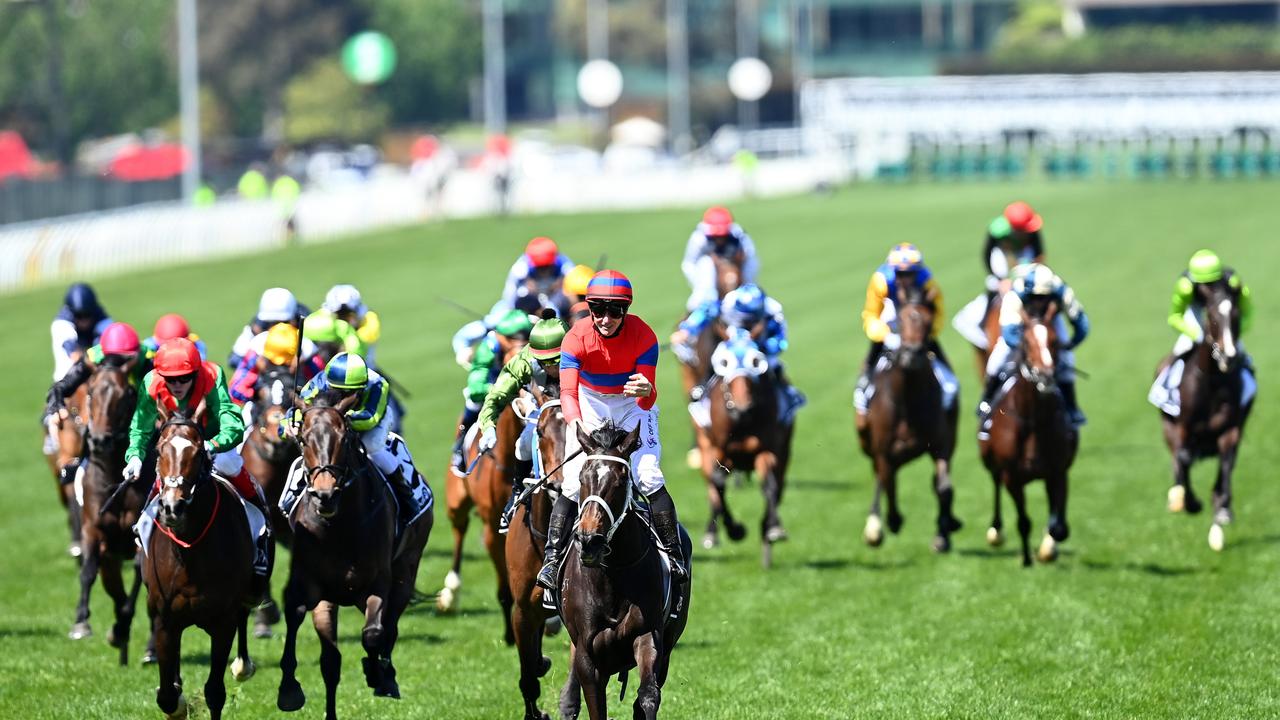 MELBOURNE, AUSTRALIA - NOVEMBER 02: James Mcdonald riding #4 Verry Elleegant celebrates winning race 7, the Lexus Melbourne Cup during 2021 Melbourne Cup Day at Flemington Racecourse on November 02, 2021 in Melbourne, Australia. (Photo by Quinn Rooney/Getty Images)