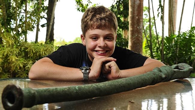 Christopher Doukas, 13, found a cannon buried in the sand on Dundee Beach while on a family outing.