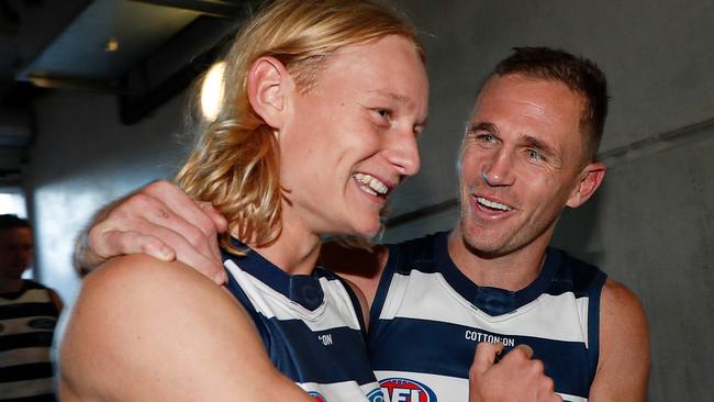 Dempsey celebrates with Geelong champion Joel Selwood after the Cats took care of North Melbourne. Picture: Michael Willson/AFL Photos via Getty Images