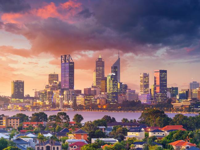 Panoramic aerial cityscape image of Perth skyline, Australia during dramatic sunset.