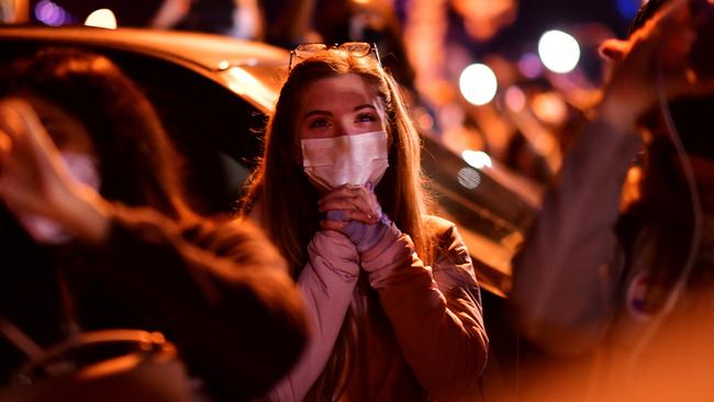 A woman reacts to the news of U.S. President-elect Joe Biden's victory speech, in Wilmington, Delaware, on November 7. Picture: Reuters