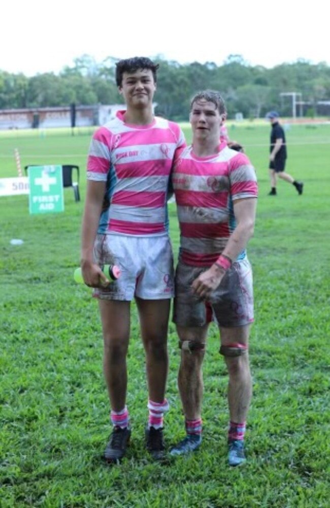 Ormiston College First XV rugby players in their pink jerseys.