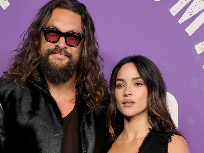 NEW YORK, NEW YORK - FEBRUARY 14: (L-R) Jason Momoa and Adria Arjona attend SNL50: The Homecoming Concert at Radio City Music Hall on February 14, 2025 in New York City.  (Photo by Dia Dipasupil/Getty Images)