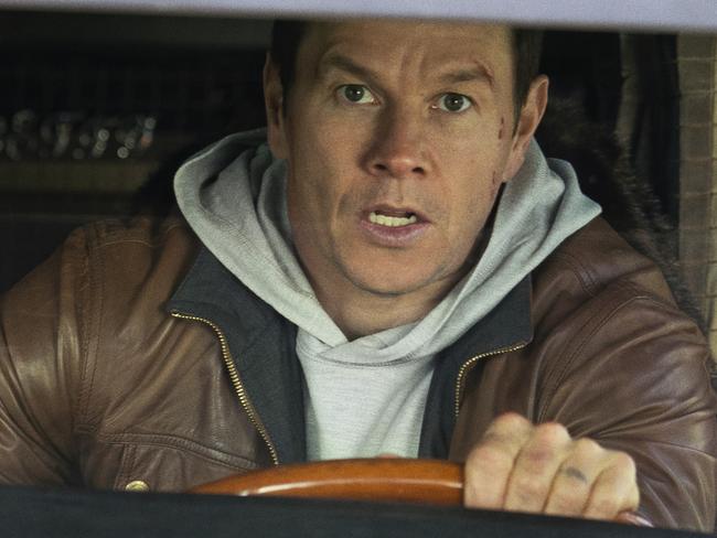 This image released by Netflix shows Mark Wahlberg, right, and Winston Duke in a scene from "Spenser Confidential." (Daniel McFadden/Netflix via AP)