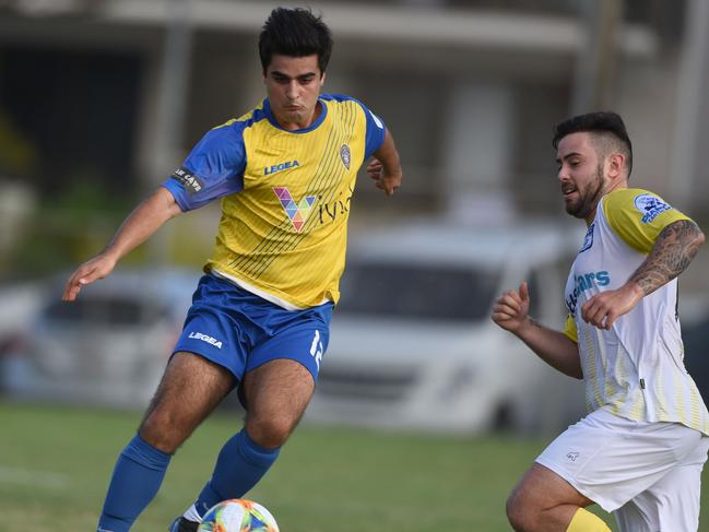 Broadbeach United's Nani Jusifi and Star's Cameron Holzheimer. Picture: Steve Holland