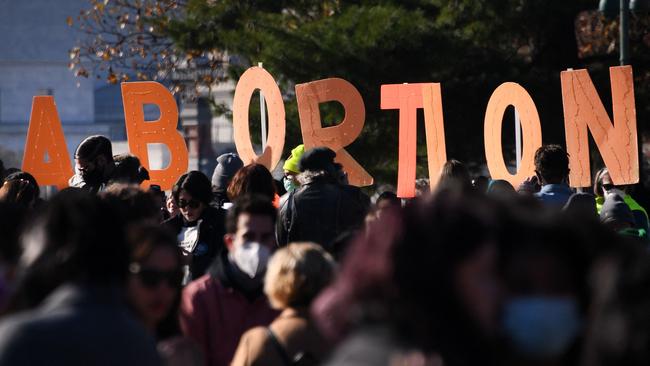 Abortion rights advocates and anti-abortion protesters demonstrate in front of the US Supreme Court in Washington DC on December 1 ahead of the Roe V Wade decision.