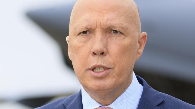 Minister for Defence, the Hon. Peter Dutton, MP addresses media at RAAF Base Amberley, Queensland. *** Local Caption *** The Australian Government has provided further support to the Government of Ukraine by gifting 20 Bushmaster Protected Mobility Vehicles, including two ambulance variants, to aid the Government of Ukraineâs response to Russiaâs unrelenting and illegal aggression.  Australiaâs response follows a direct request from President Zelenskyy during his address to a joint sitting of the Parliament of Australian on 31 March 2022.  The Bushmaster Protected Mobility Vehicle was built in Australia to provide protected mobility transport, safely moving soldiers to a battle area prior to dismounting for close combat. The Bushmaster Protected Mobility Vehicle is well suited to provide protection to the Ukrainian Armed Forces soldiers and Ukrainian civilians against mines and improvised explosive devices, shrapnel from artillery and small arms fire.  The vehicles have been painted olive green to suit the operating environment. Additionally, a Ukrainian flag is painted on either side with the words âUnited with Ukraineâ stencilled in English and Ukrainian to acknowledge our commitment and support to the Government and people of Ukraine. The ambulances will have the traditional red cross emblem.  The Bushmaster Protected Mobility Vehicles will be fitted with radios, a global positioning system and additional bolt-on armour increasing their protection.