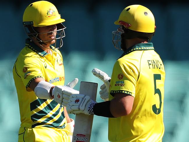 Australia's Aaron Finch congratulates David Warner on his 50 runs during the Australia v NZ One Day International cricket match at the SCG. Picture: Brett Costello