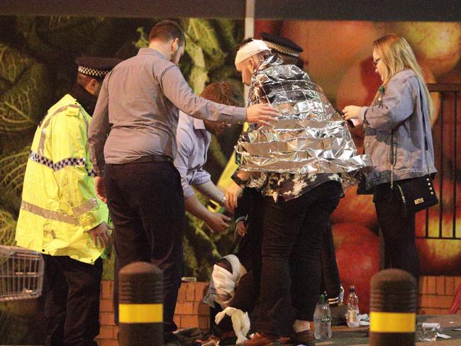 Emergency services attend the injured after the explosion. Picture: Joel Goodman/LNP