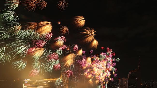 Fireworks explode over the Chao Phraya River during New Year celebrations in Bangkok, Thailand. Picture: Sakchai Lalit/AP