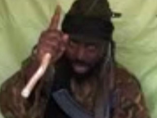 A screengrab taken on April 19, 2014, from a video obtained by AFP shows a man claiming to be the leader of Nigerian Islamist extremist group Boko Haram Abubakar Shekau. The leader of Nigeria's Boko Haram Islamists Abubakar Shekau claimed responsibility for a bombing in Nigeria's capital that killed at least 75 people, in a video message obtained by AFP on April 19. AFP PHOTO / BOKO HARAM RESTRICTED TO EDITORIAL USE - MANDATORY CREDIT 