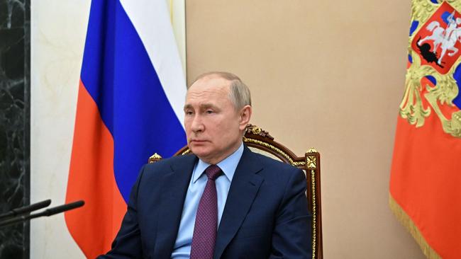 Vladimir Putin attends a meeting with Russian Defence Minister Sergei Shoigu at the Kremlin. Picture: AFP.