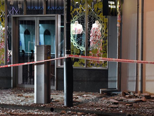 Glass and masonry on the footpath in Wakefield Street, Wellington. Picture: AAP