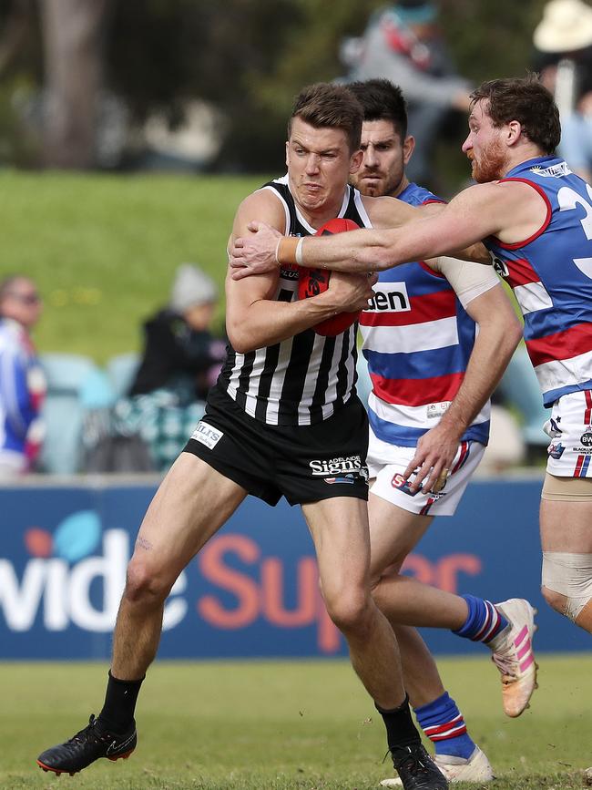 Jack Trengove tries to get past Central District’s Jarrod Schiller Picture SARAH REED