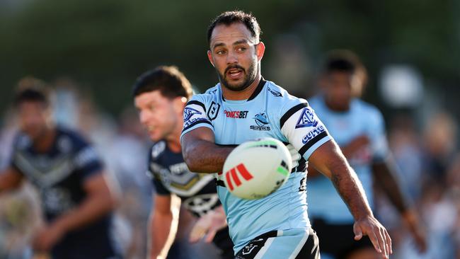 SYDNEY, AUSTRALIA - APRIL 21: Braydon Trindall of the Sharks passes the ball to a team mate during the round seven NRL match between Cronulla Sharks and North Queensland Cowboys at PointsBet Stadium, on April 21, 2024, in Sydney, Australia. (Photo by Brendon Thorne/Getty Images)