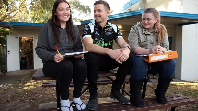 V8 legend Mark “Frosty” Winterbottom helps out Kerryann Dubos and Shannon O'Connor. Picture: Sam Ruttyn