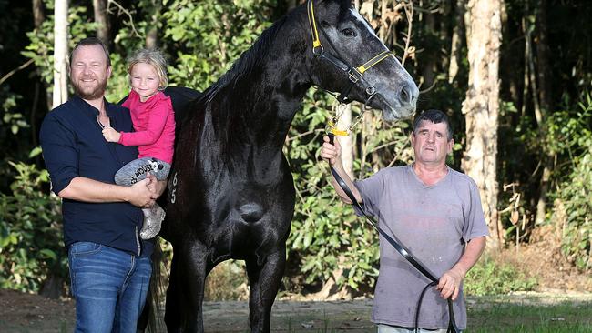 Race horse owner Chris Jorgensen and his daughter Athena with his horse Taveuni and Cairns Trainer Rodney Miller. PICTURE: STEWART MCLEAN