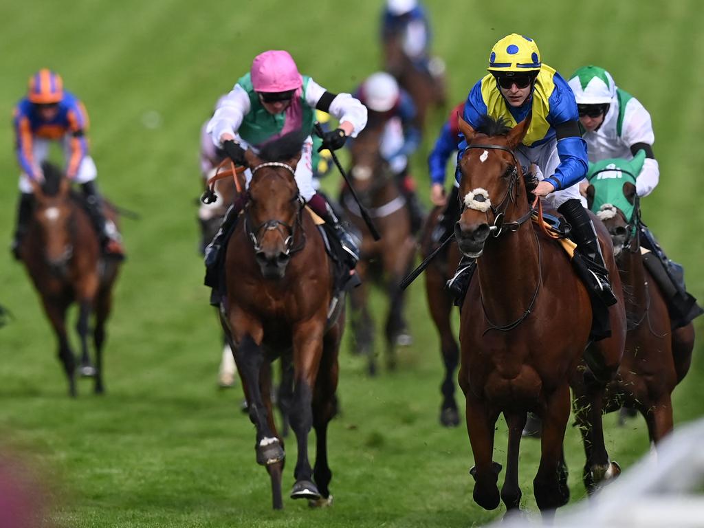 Richard Kingscote riding Desert Crown to victory in the Cazoo Derby. Picture: AFP.