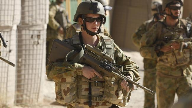 On the front line in Afghanistan, Jacqui de Gelder a medic from 3 Combat Support Battalion, on patrol in Chora. Women will not have custom kit for deployments. Picture: Gary Ramage