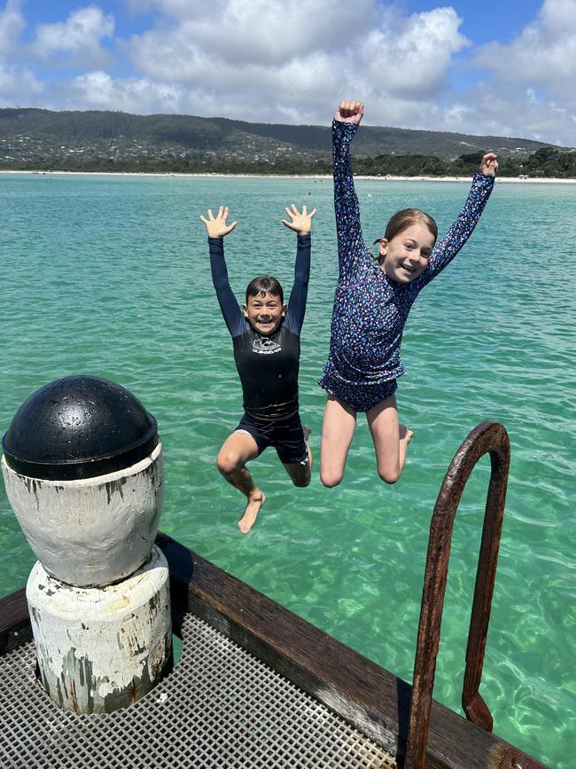 Charlie and Maddie McGloin doing a pier jump at Rosebud. Picture: Charlie McGloin, Aspendale.