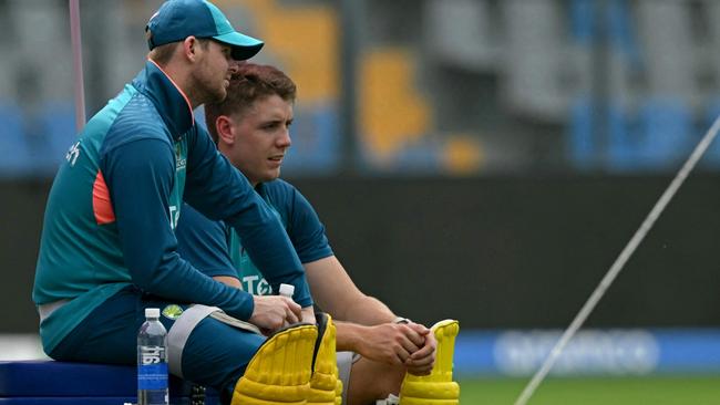 Steve Smith (left) and Cameron Green have been left out of the Australian side. (Photo by Indranil MUKHERJEE / AFP)