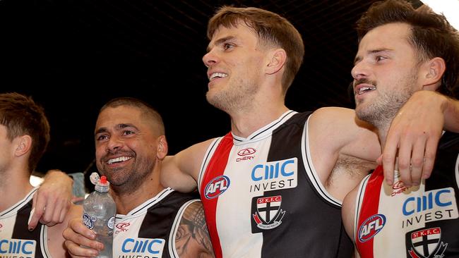 MELBOURNE, AUSTRALIA - JULY 07: Bradley Hill, Mason Wood and Jack Sinclair of the Saints the song after the win during the round 17 AFL match between St Kilda Saints and Sydney Swans at Marvel Stadium, on July 07, 2024, in Melbourne, Australia. (Photo by Kelly Defina/Getty Images)