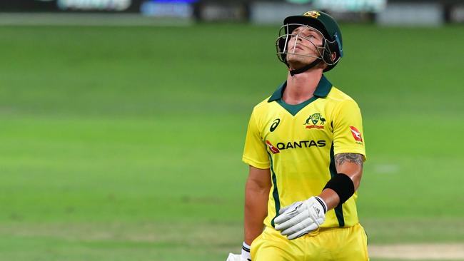 Australian cricketer Ben McDermott leaves the pitch after being dismissed during the third T20 cricket match between Pakistan and Australia at The International Cricket Stadium in Dubai on October 28, 2018. (Photo by GIUSEPPE CACACE / AFP)