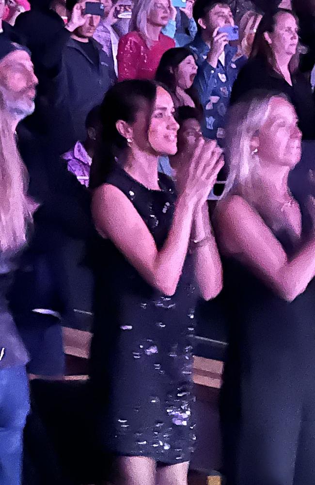 Meghan wore a sequinned black dress for the occasion. Picture: Mega Agency