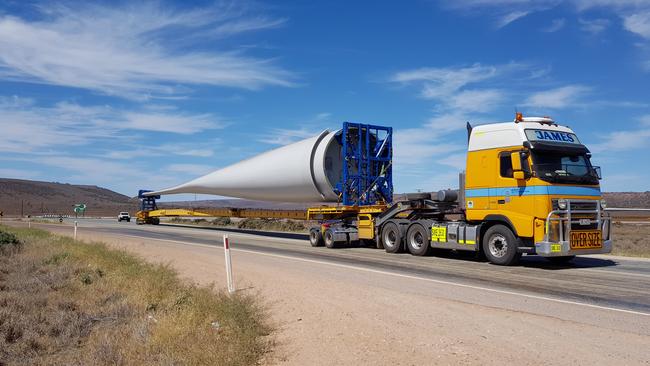 Turbine parts being transported by road to the wind farm site.