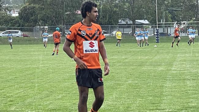 Summer rains fall on Joshua Donovan at Leo Williams Oval.