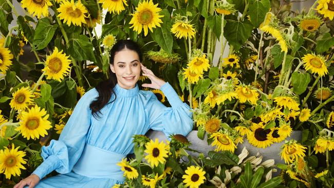 Model Bonnie Jackson among an installation of sunflowers at the National Gallery of Australia. Picture: Rohan Thomson