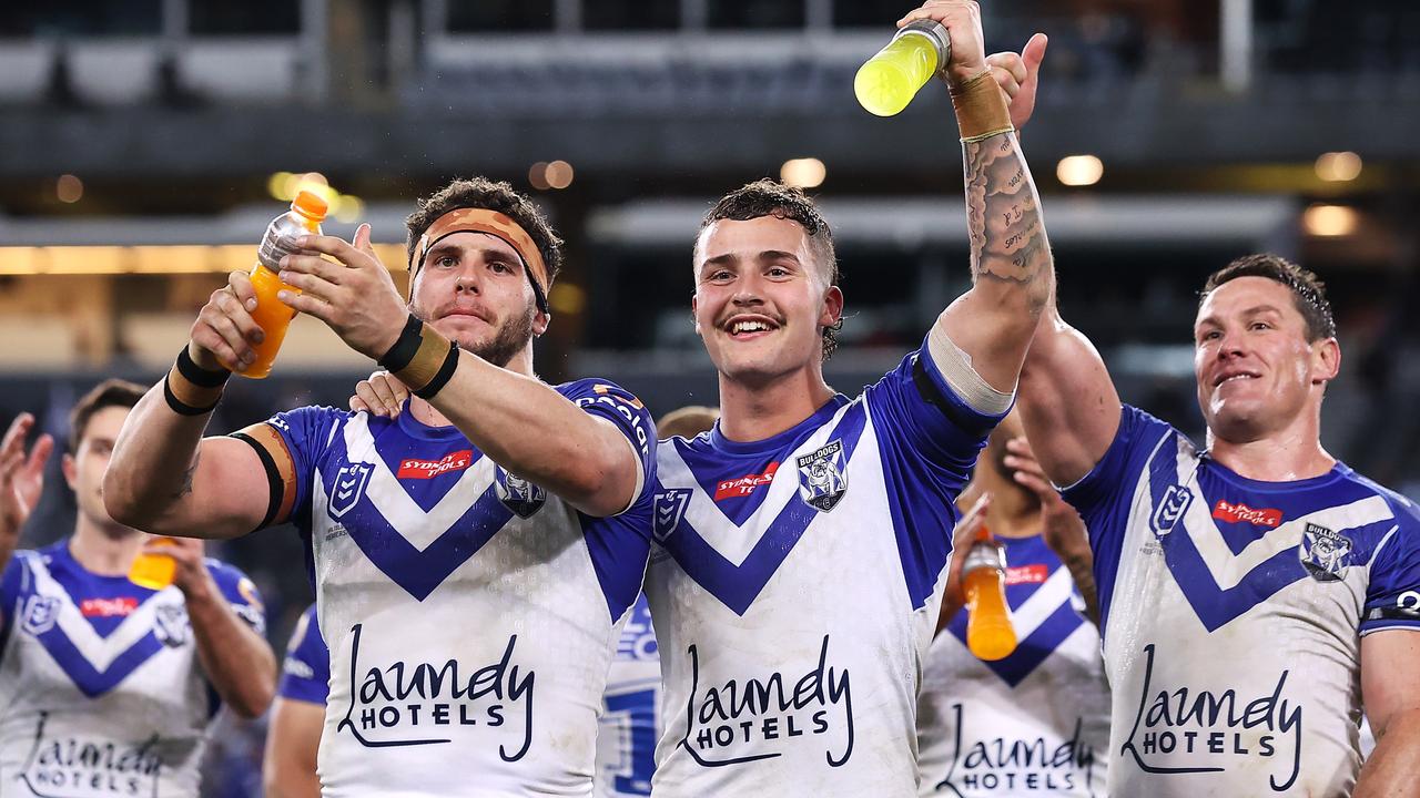 Adam Elliot, Aaron Schoupp and Josh Jackson of the Bulldogs thank the crowd after their round 14 win.