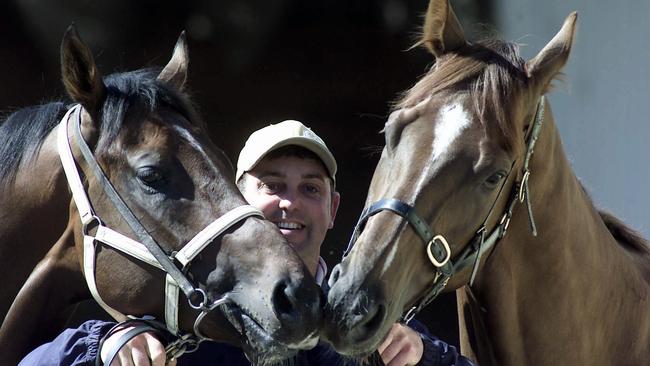 Tommy Hughes Junior with racehorses Titanic Jack and Delago Brom in 2002. Picture: Colin Murty