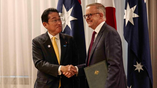 Albanese (R) shakes hands with Japanese Prime Minister Fumio Kishida in Perth last month, where the pair signed a joint security pact.