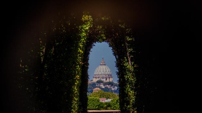 Spectacular view of St. Peter's Basilica from the keyhole on the Palace of Knights of Malta.