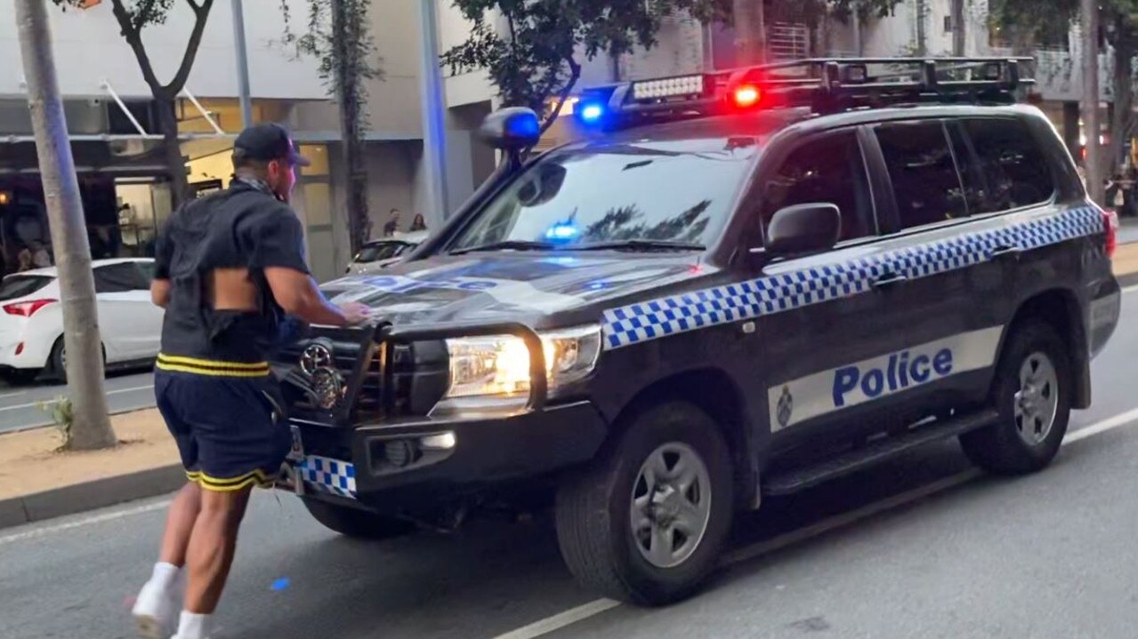 Topai-Aveai holds on to the bullbar as police attempt to reverse away.