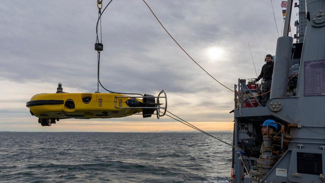 Crew on the Huon-class Coastal Minehunter HMAS Diamantina launch a Mine Disposal Vehicle on Port Phillip Bay, Victoria, in June 2022. Picture: Department of Defence