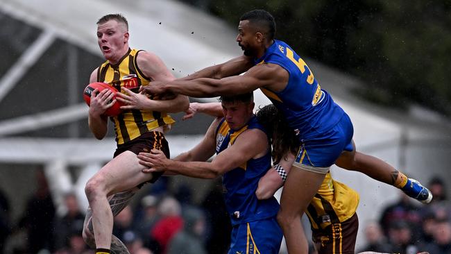 Rowville and Noble Park players were prepared to put their bodies on the line. Picture: Andy Brownbill