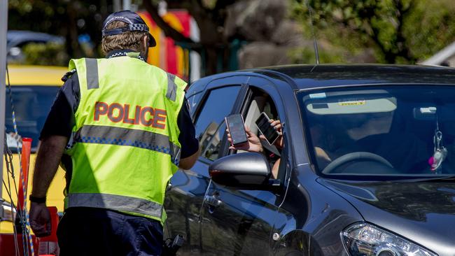 The Queensland Premier has announced changes to the border restrictions and says that no more police will be needed to patrol the state's borders with New South Wales. Police at the Griffith St, Coolangatta, border site. Picture: Jerad Williams