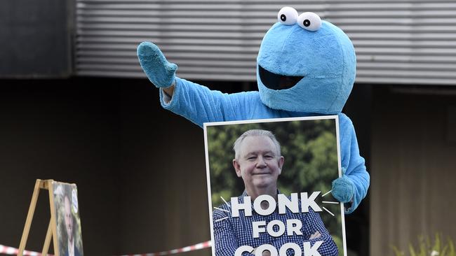 The Cookie Monster in support of Ian Cook, Independent candidate in the Mulgrave by-election, at a polling station in Noble Park. Picture: Andrew Henshaw