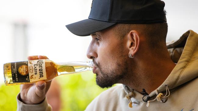 Nick Kyrgios cracks a beer after playing table tennis against Jordan Thompson at The Rooftop At QT, Melbourne. Picture: Mark Stewart