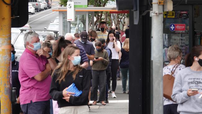 A large queue of people outside a Hawthorn East pharmacy lining up for Rapid Antigen Tests. Picture: Alex Coppel.