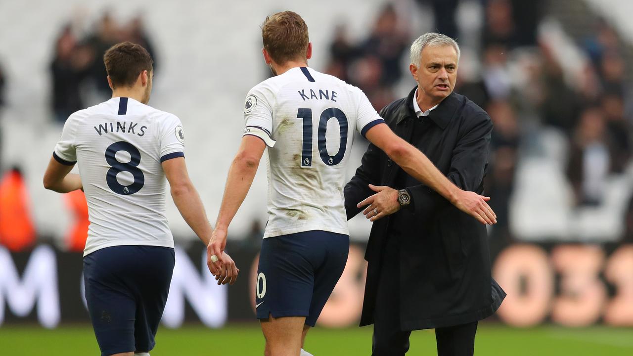 Jose Mourinho congratulates Harry Kane after a 3-2 win in his first match as Tottenham boss.