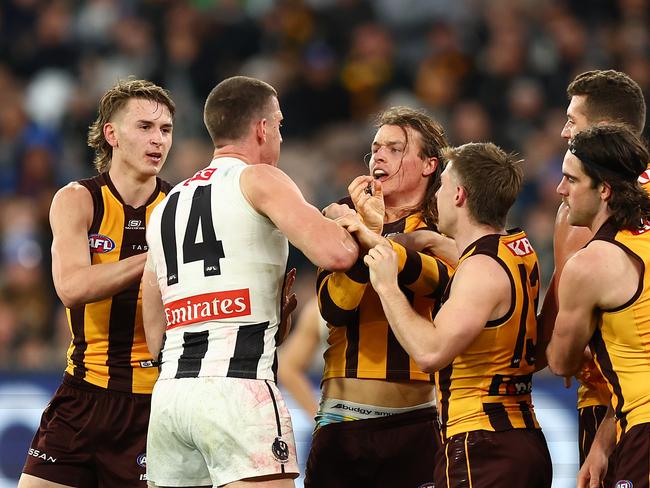 Darcy Cameron tangles with former teammate Jack Ginnivan. Picture: Graham Denholm/AFL Photos/via Getty Images