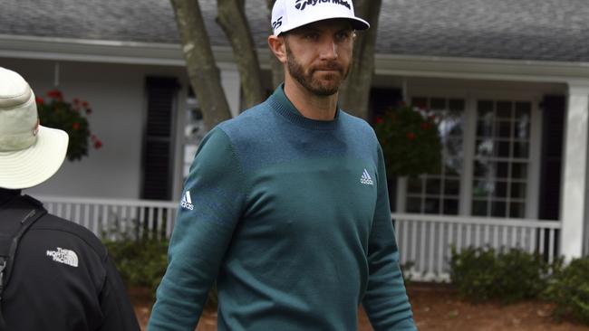 Dustin Johnson came to the first tee hopeful of play but had to concede his body wasn’t up to it.