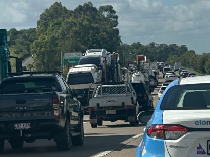 Gold Coast traffic: Emergency services called to motorbike and car crash on the M1 in Arundel. Photo: Ashleigh Jansen