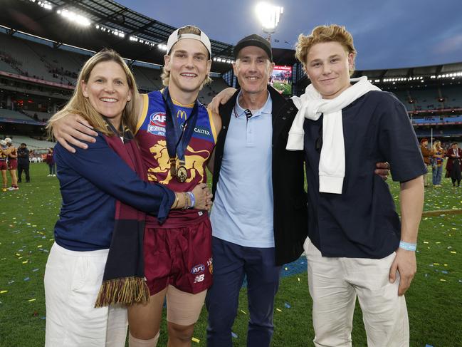 Will Ashcroft of the Lions with his parents Rebecca and Marcus and brother Levi. Picture: Michael Klein