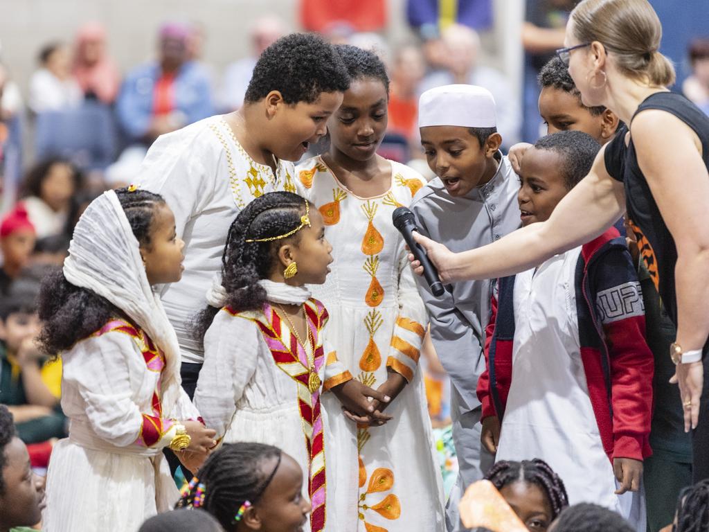 Saying hello in their language are students representing Ethiopia during Harmony Day celebrations at Darling Heights State School. Picture: Kevin Farmer